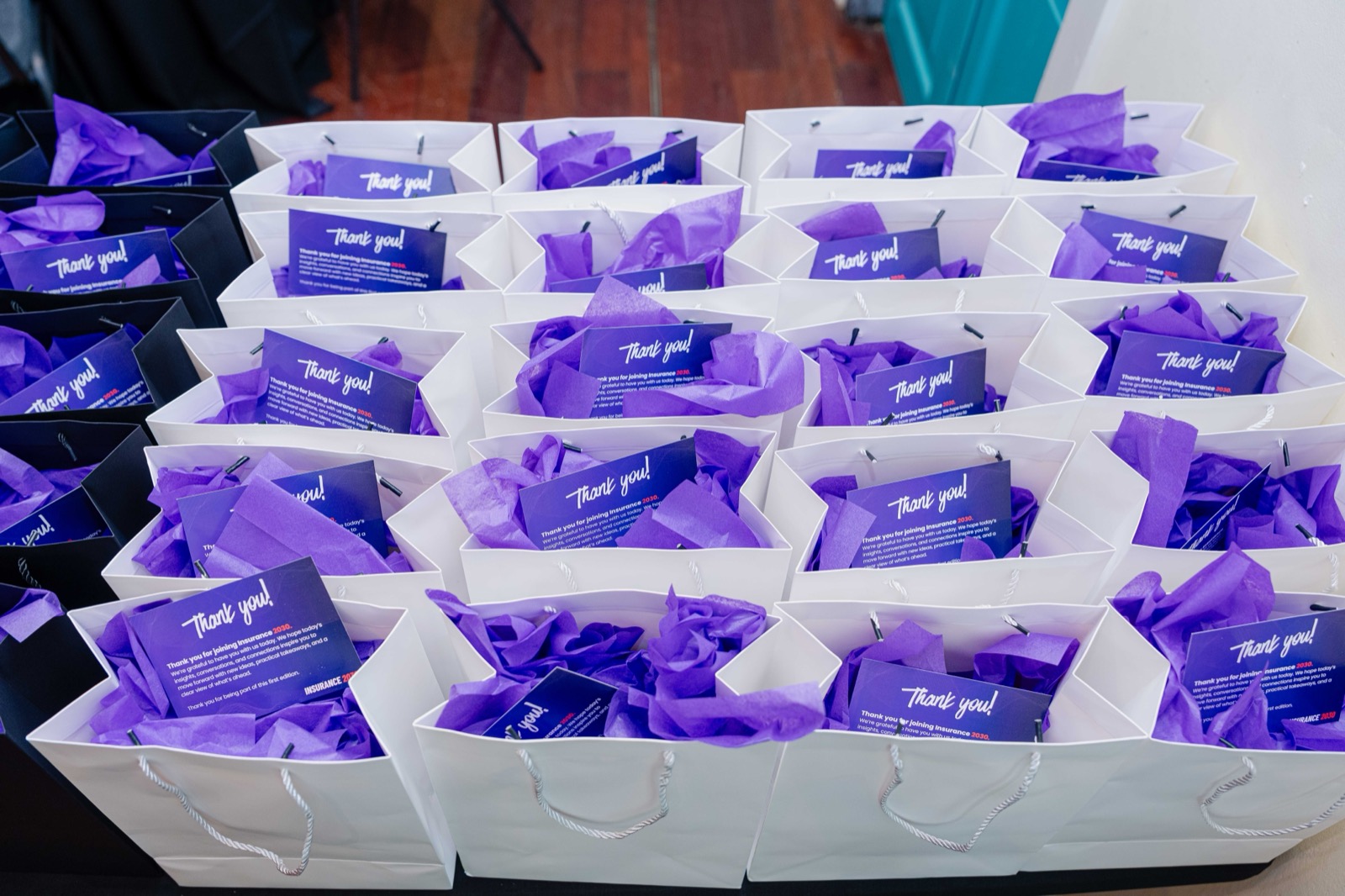 Gift bags with thank-you cards at the event entrance