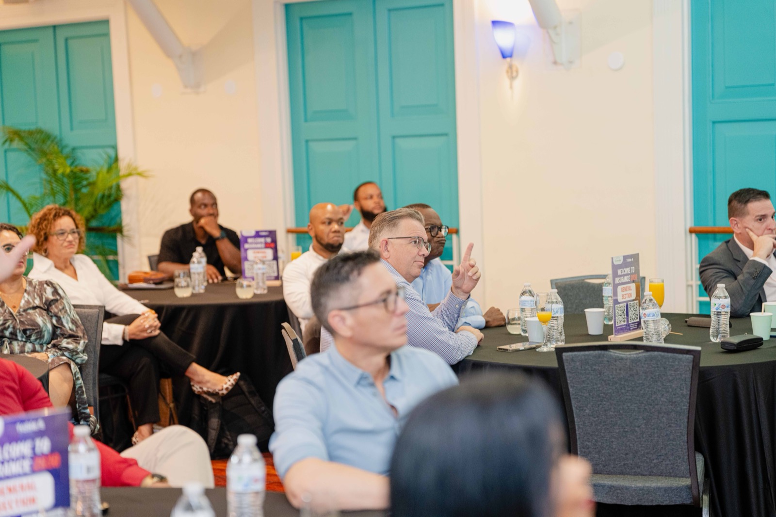 Attendee raising a hand during the Q&A session